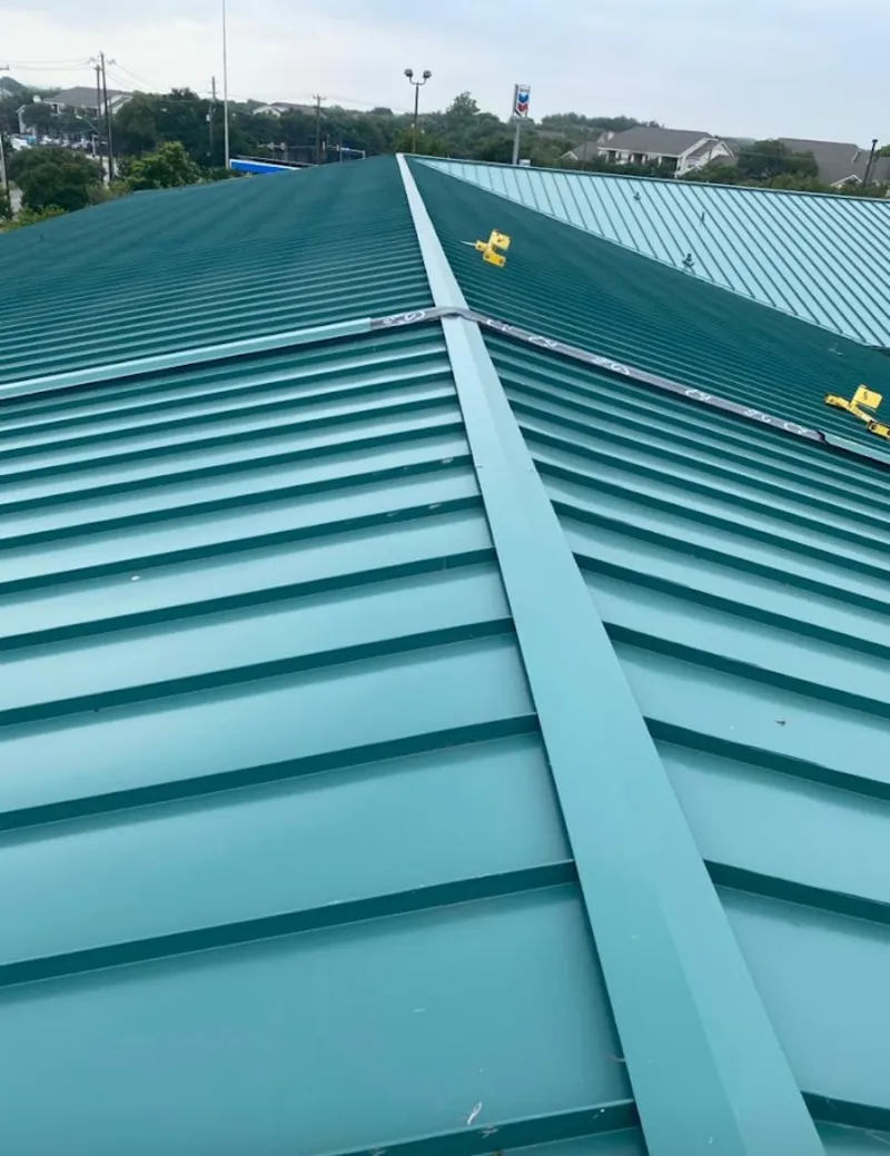 Green commercial metal roof ridge and valley for Metal Roof Repair in North Star